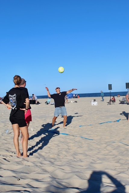Two players track the ball in the air