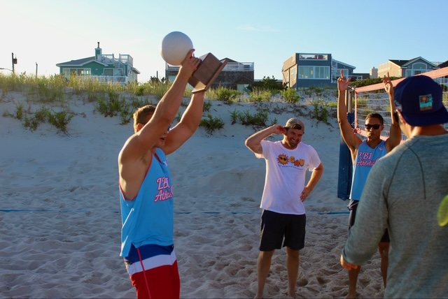 The first-place trophy goes up